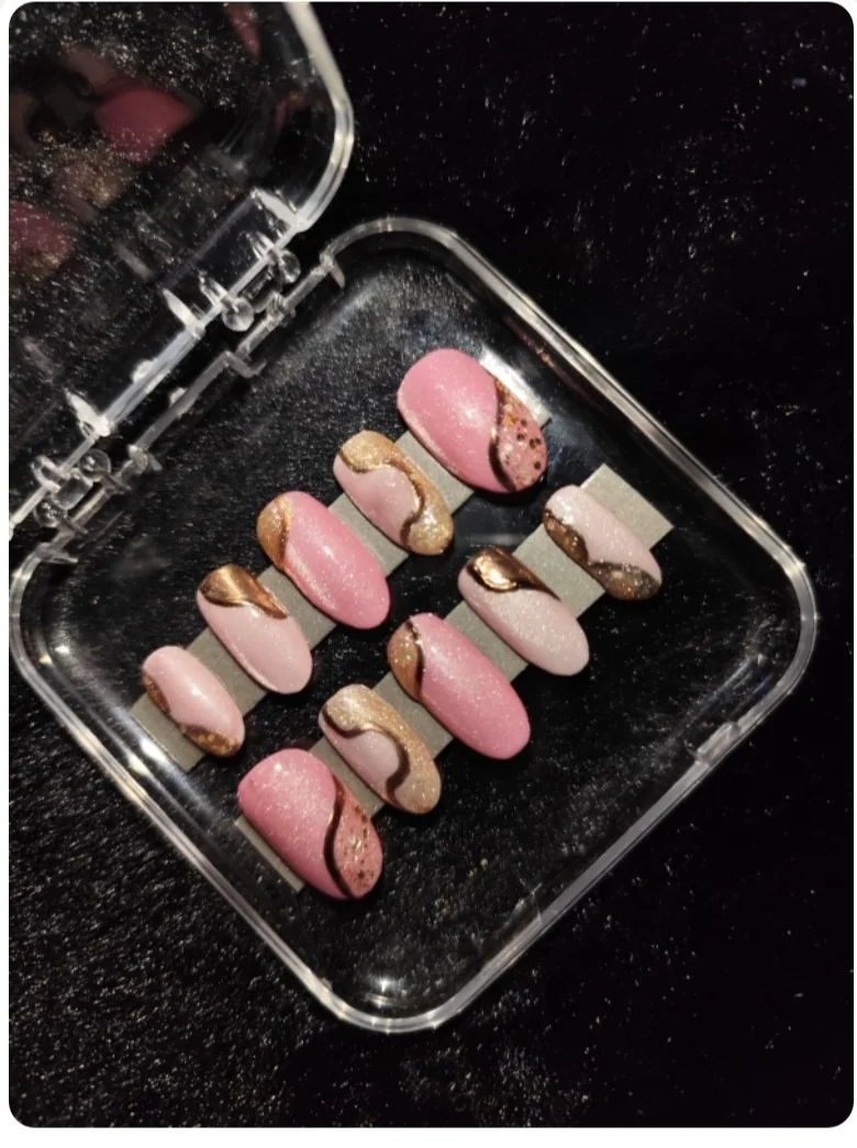 Pink and gold first custom nail set